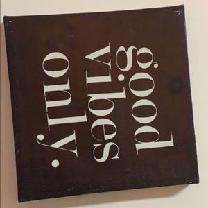 “Good vibes” wall art.